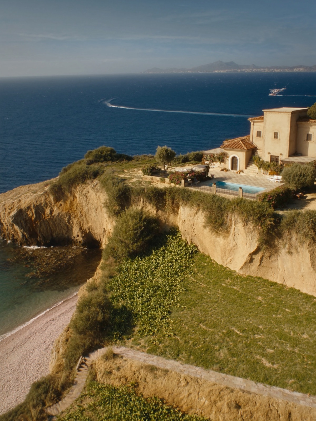A honey-stone Sicilian villa on a wild coastline near Scopello among olive and prickly pear